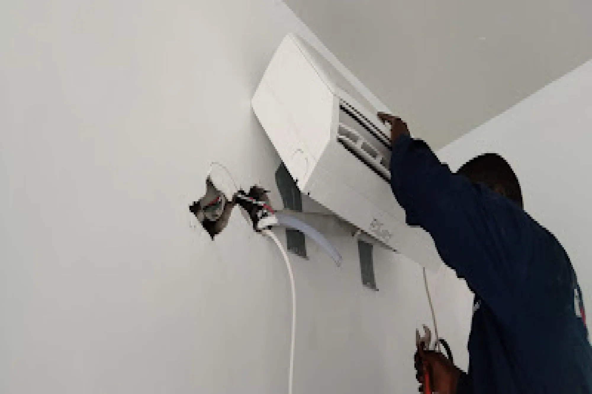HVAC technician performing maintenance